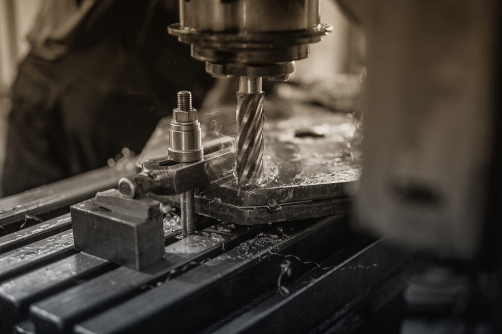 Industrial machine drilling metal